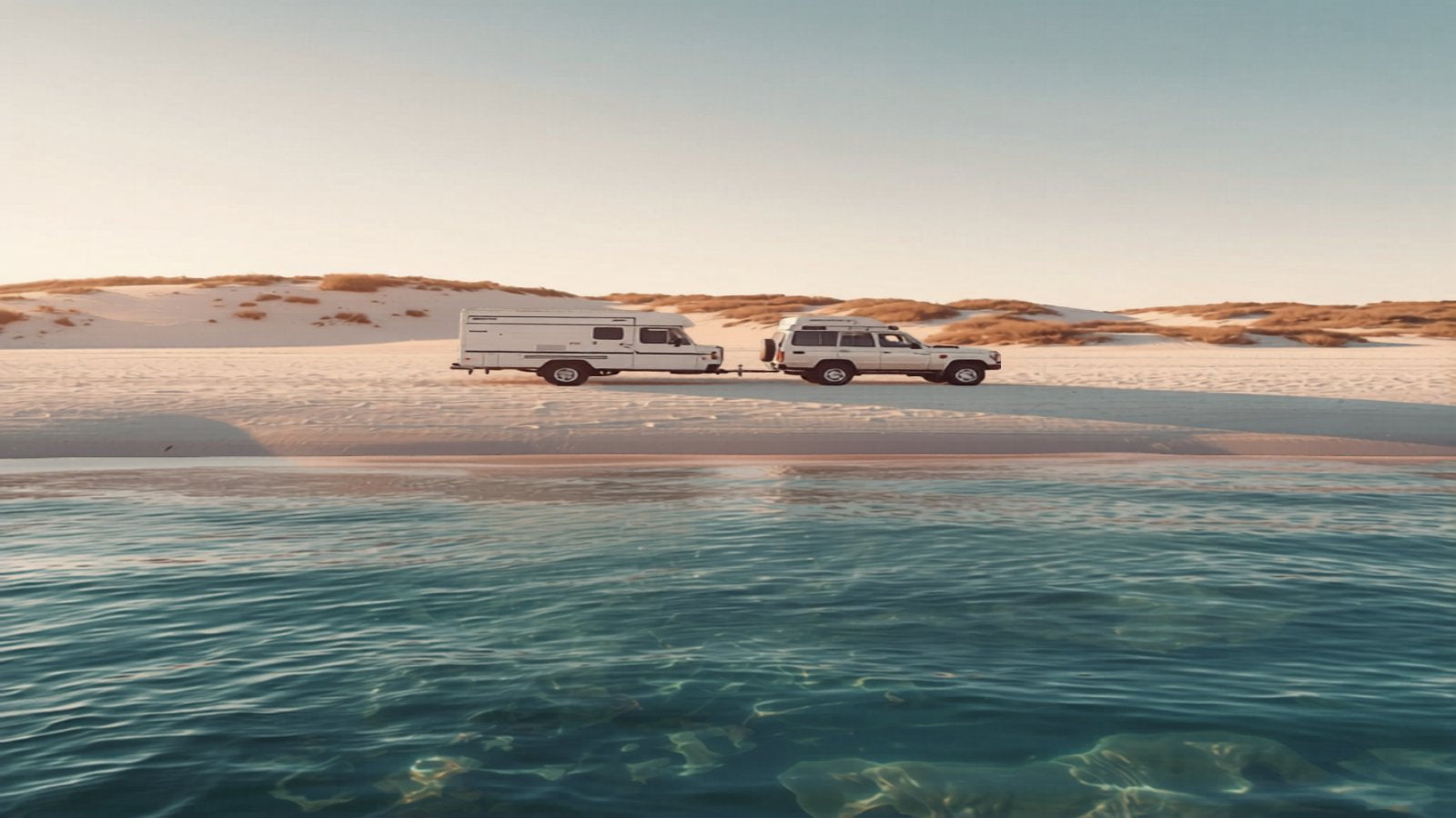 4WD and caravan on a pristine white sand beach at golden hour on South Australia's Eyre Peninsula