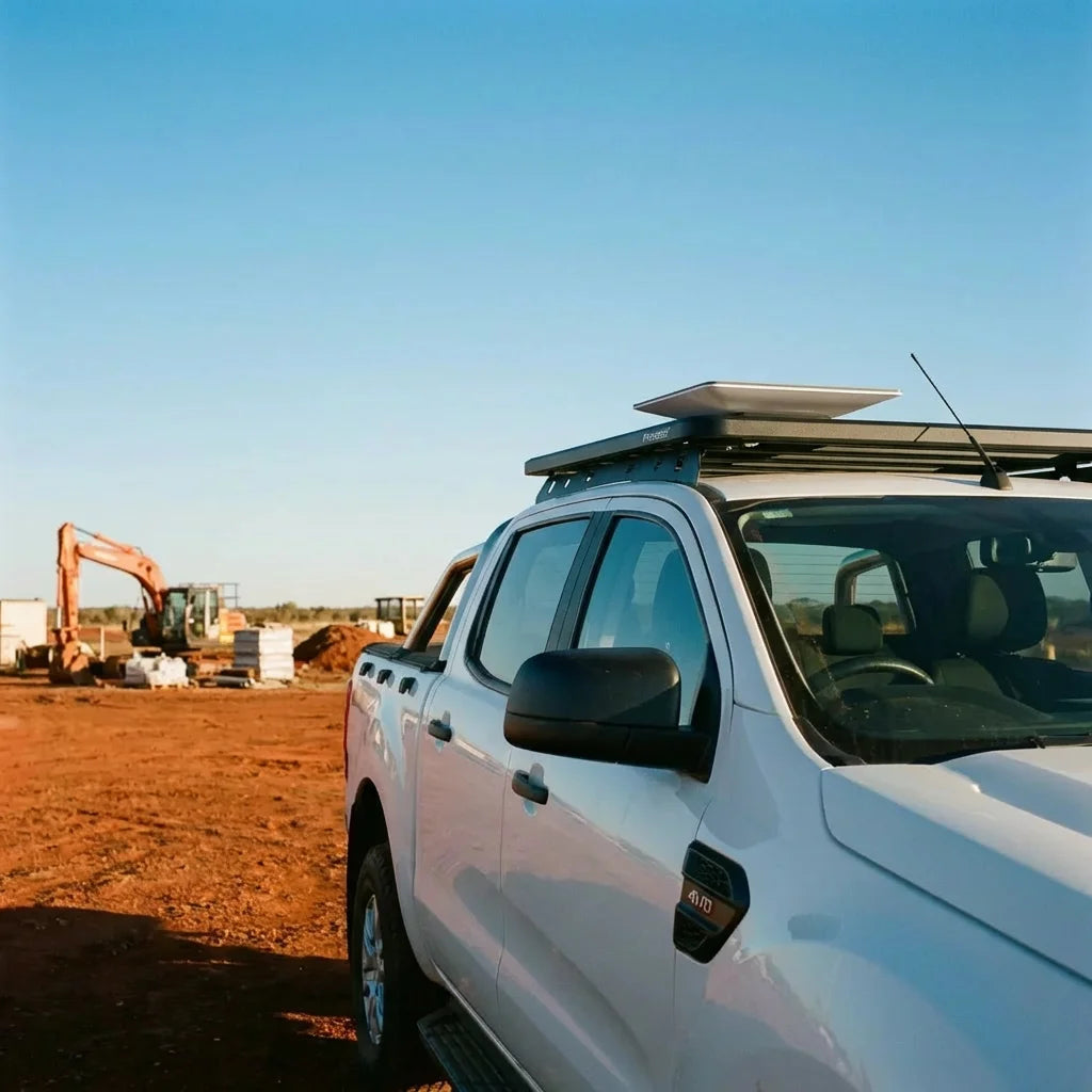 Starlink Mini mounted flat on a roof rack on a work ute in the outback