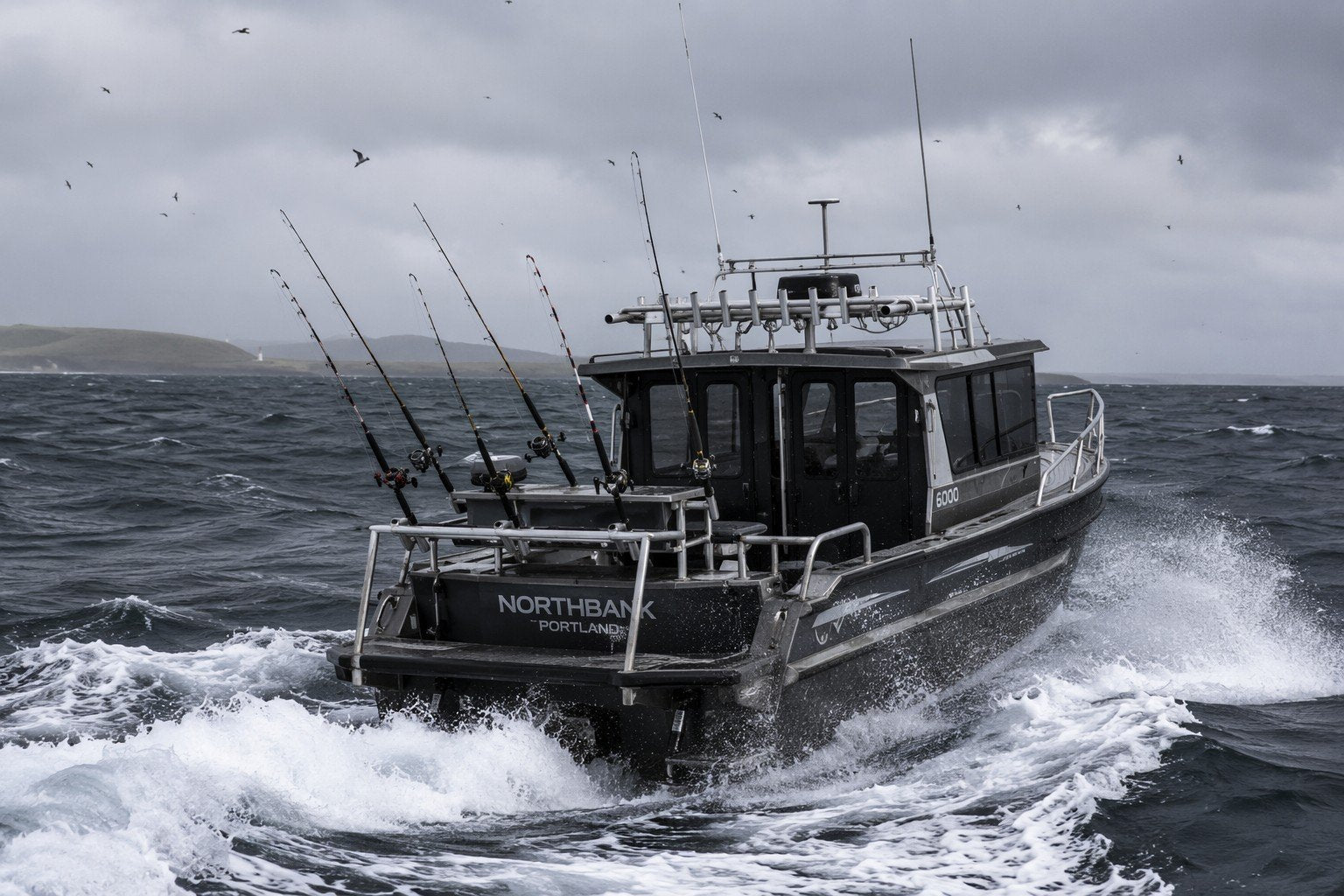 Rugged aluminium offshore fishing boat trolling for tuna in a winter swell near Portland, Victoria