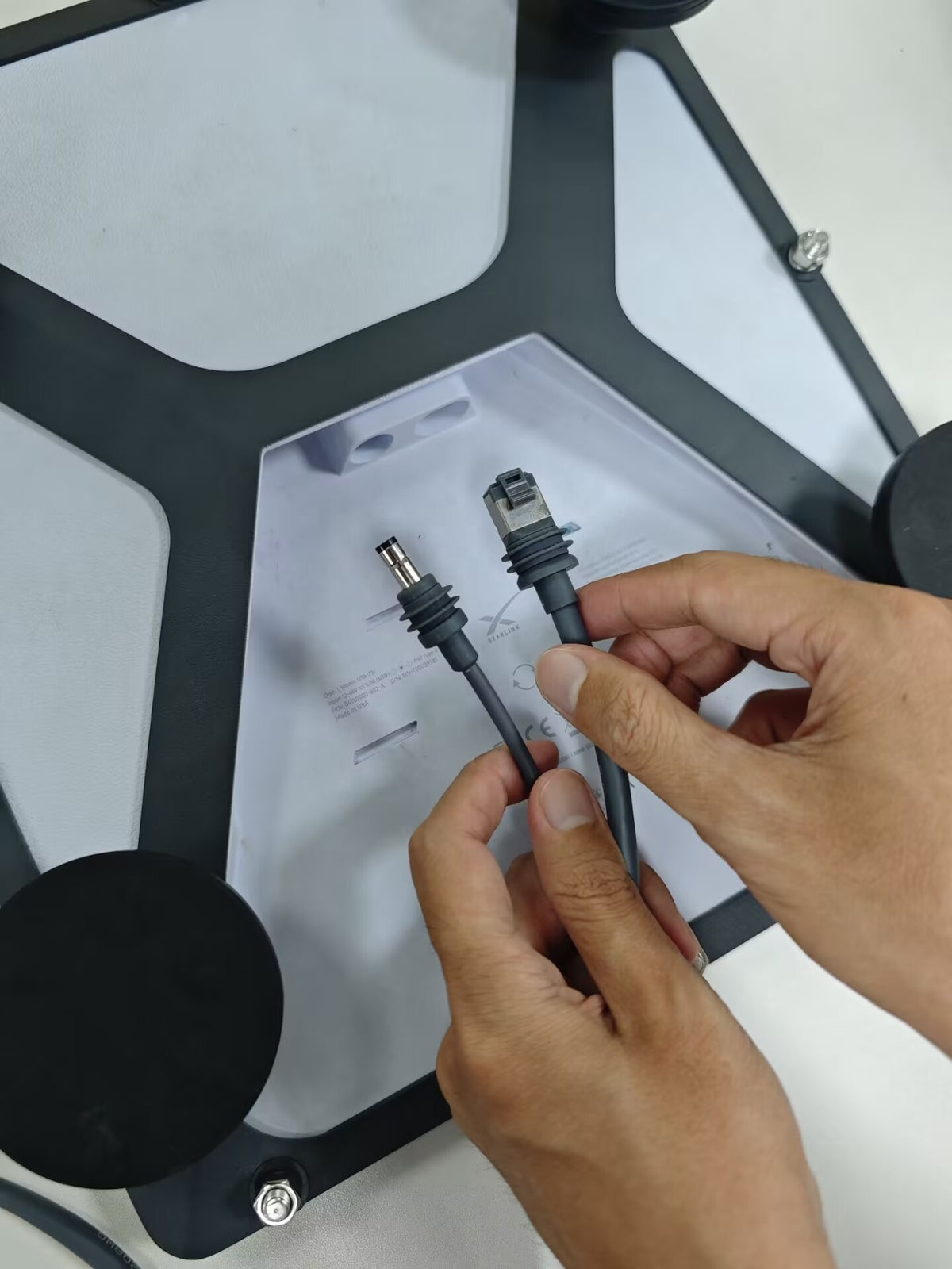 Outcamp 2-in-1 cable running to Starlink Mini on roof mount