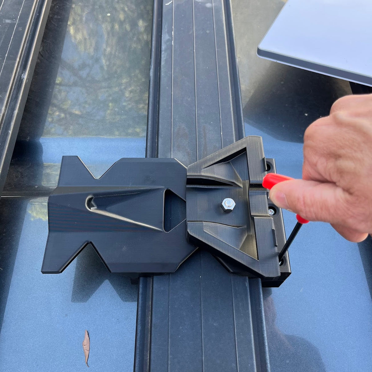 Starlink Mini dish installation showing the bracket slid onto the ARB Base rack rails