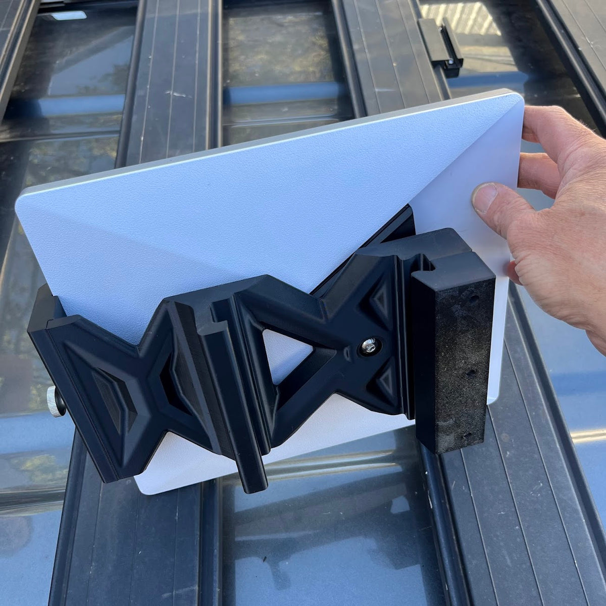 Starlink Mini dish clipped onto the low-profile ARB Base rack mount