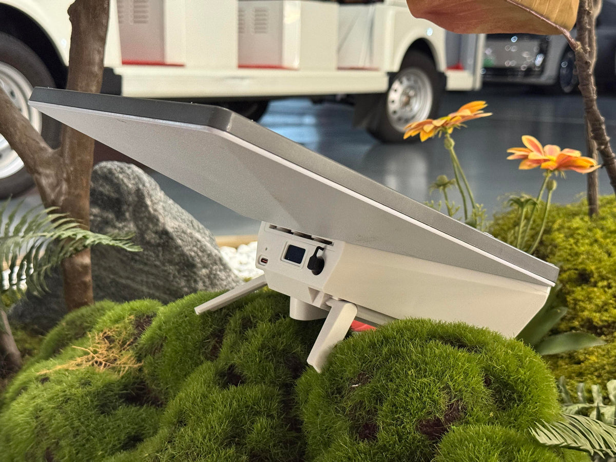 Starlink Mini with the 219Wh power bank fitted and kickstand open, photographed outdoors