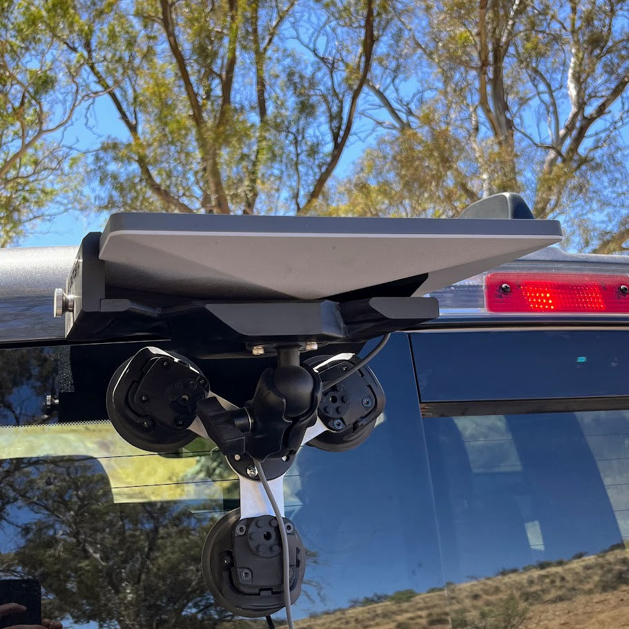 Starlink Mini suction cup mount fitted behind vehicle cabin