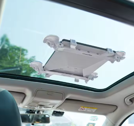 Starlink Mini dish mounted inside vehicle via suction