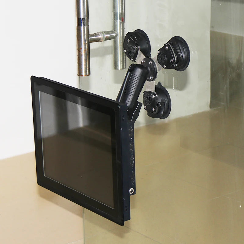 Triple suction cup mount in real-world action holding a tablet against a glass door surface, demonstrating heavy-duty grip on smooth vertical glass