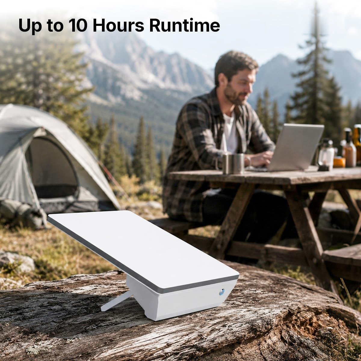 Starlink Mini power bank running in camp with a tent, mountains and a laptop being used, up to 10 hours runtime
