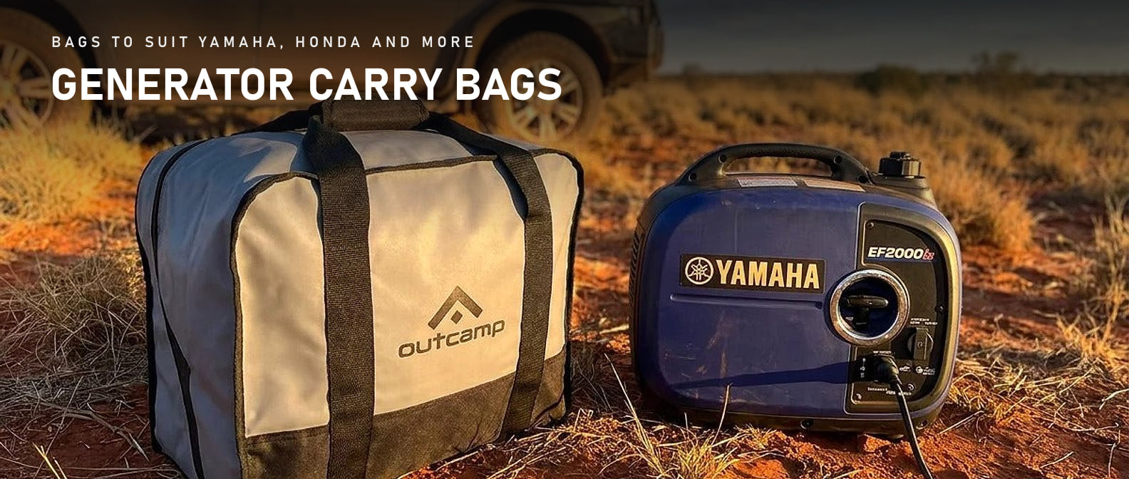 Outcamp generator carry bag beside a Yamaha EF2000iS inverter generator in red outback dirt at sunset