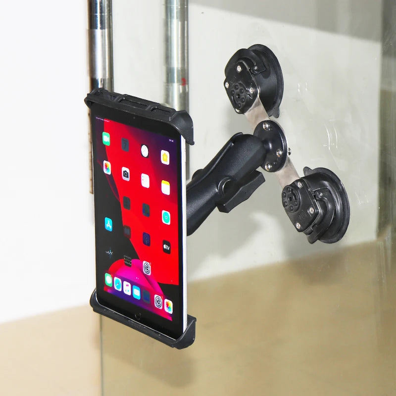 Tablet mounted on a glass partition using the dual suction base and a 1.5 inch ball arm.