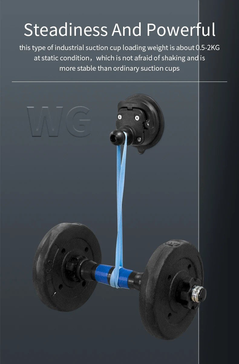 Stability load test: industrial twist-lock suction cup mounted to vertical glass holding a hanging dumbbell rig, demonstrating strong vacuum grip